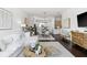 Open-concept living space with stylish furnishings, hardwood floors, and modern decor at 820 2Nd N Ave, St Petersburg, FL 33701