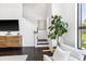 Living room with hardwood floors, neutral decor, and a staircase at 820 2Nd N Ave, St Petersburg, FL 33701