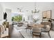 Bright living room with large windows, modern furnishings, and hardwood floors at 820 2Nd N Ave, St Petersburg, FL 33701