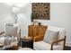 Cozy sitting room featuring comfortable armchairs, dark wood floors, and tasteful decor at 820 2Nd N Ave, St Petersburg, FL 33701