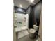 Cozy bathroom featuring a walk-in shower, gray tile flooring, and a modern white toilet at 821 Lucent Sands Ct, Brandon, FL 33511