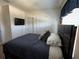 Bedroom with comfortable bed, TV, and closet space at 821 Lucent Sands Ct, Brandon, FL 33511