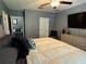 Bedroom featuring a large bed, mounted TV and stylish decor at 821 Lucent Sands Ct, Brandon, FL 33511