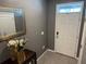 Welcoming entryway with a decorative mirror, stylish console table, and ample natural light at 821 Lucent Sands Ct, Brandon, FL 33511