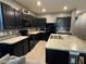 Beautiful kitchen featuring an island, stainless steel appliances, and stylish tile backsplash at 821 Lucent Sands Ct, Brandon, FL 33511