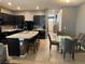 Spacious kitchen and dining area with tile flooring, large island and ample cabinet space at 821 Lucent Sands Ct, Brandon, FL 33511