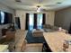 Comfortable living room with plush seating, natural light, and seamless connection to outdoor spaces at 821 Lucent Sands Ct, Brandon, FL 33511