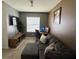 Inviting living room with comfortable seating, a TV, and a window that provides natural light at 821 Lucent Sands Ct, Brandon, FL 33511