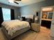 Bedroom featuring a large bed and ensuite bath at 821 Lucent Sands Ct, Brandon, FL 33511