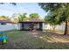 Spacious backyard with screened porch and BBQ; perfect for outdoor gatherings at 8523 N Newport Ave, Tampa, FL 33604