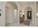 Elegant foyer with tiled floors, arched doorways, and a stylish console table at 8523 N Newport Ave, Tampa, FL 33604