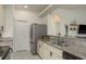 Modern kitchen featuring stainless steel appliances, granite countertops, and ample storage space at 8523 N Newport Ave, Tampa, FL 33604