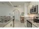 Modern kitchen with stainless steel appliances, granite countertops, and bright, neutral tones at 8523 N Newport Ave, Tampa, FL 33604