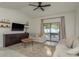 Cozy living room with comfortable seating, media center, and access to outdoor patio at 8523 N Newport Ave, Tampa, FL 33604
