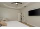 Spacious main bedroom with hardwood floors, tray ceilings, TV and lots of space at 8523 N Newport Ave, Tampa, FL 33604