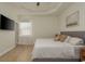 Light-filled main bedroom features neutral walls, hardwood floors and natural light at 8523 N Newport Ave, Tampa, FL 33604