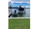 Features private boat lift with a boat, along with a second boat covered, providing convenience for water enthusiasts at 861 180Th E Ave, Redington Shores, FL 33708