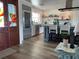 Bright kitchen featuring a breakfast bar, modern appliances, and a decorative stained-glass door at 861 180Th E Ave, Redington Shores, FL 33708