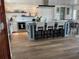 Open-concept kitchen with island seating, stainless steel appliances, and decorative backsplash at 861 180Th E Ave, Redington Shores, FL 33708