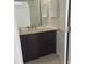 Bathroom showcasing a granite vanity with a storage cabinet providing both style and functionality at 8665 55Th N St, Pinellas Park, FL 33782