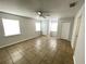 Bright bedroom featuring neutral walls, tile flooring, ceiling fan and double closets at 8665 55Th N St, Pinellas Park, FL 33782
