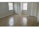 Bedroom with tile floors, two closets, and abundant natural light at 8665 55Th N St, Pinellas Park, FL 33782