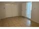 Bedroom featuring tile floors, closet space and neutral paint at 8665 55Th N St, Pinellas Park, FL 33782