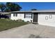 Charming single-story home featuring a well-maintained lawn and a concrete driveway at 8665 55Th N St, Pinellas Park, FL 33782