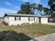 Inviting single-story home with manicured lawn, offering curb appeal and a welcoming entrance at 8665 55Th N St, Pinellas Park, FL 33782