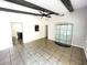 Bright living room featuring tile floors, exposed beams, and ample space for entertaining guests at 8665 55Th N St, Pinellas Park, FL 33782