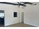 Bright living room with tile floors, ceiling fan, and pass-through to kitchen at 8665 55Th N St, Pinellas Park, FL 33782
