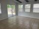 Bright living room with natural light and a sliding glass door leading to the backyard at 8665 55Th N St, Pinellas Park, FL 33782