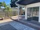 Outdoor patio with pavers and a sliding glass door, perfect for relaxing and enjoying the backyard at 8665 55Th N St, Pinellas Park, FL 33782