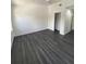 Bedroom with sleek floors, fan, and closet at 8708 Cobbler Pl, Tampa, FL 33615