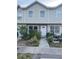 Traditional townhouse showcasing a tidy front yard and a welcoming entrance at 8708 Cobbler Pl, Tampa, FL 33615
