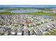Aerial view of the community and surrounding area with pond views at 8812 Parsons Hill Blvd, Wesley Chapel, FL 33545