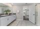 Bathroom featuring double sinks, granite counters, neutral wall paint, and a decorative vase at 8812 Parsons Hill Blvd, Wesley Chapel, FL 33545