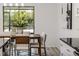 Bright dining area with sliding glass doors and backyard view at 8812 Parsons Hill Blvd, Wesley Chapel, FL 33545