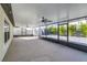 Large screened-in patio with neutral floor and views to backyard at 8812 Parsons Hill Blvd, Wesley Chapel, FL 33545