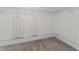 Walk-in closet featuring wire shelving and carpet flooring at 8812 Parsons Hill Blvd, Wesley Chapel, FL 33545