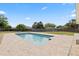Swimming pool with a brick patio, and a large fenced-in backyard at 8918 Carmen Ln, Port Richey, FL 34668