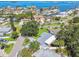 Scenic aerial shot of waterfront homes boasting lush landscaping and stunning bay views in a sought-after neighborhood at 94 Nicholas Dr, Dunedin, FL 34698