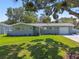 Charming home with well-maintained lawn, updated exterior, and inviting curb appeal in a quiet neighborhood at 94 Nicholas Dr, Dunedin, FL 34698