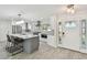 Bright, updated kitchen with granite countertops, stainless steel appliances, and white cabinetry at 94 Nicholas Dr, Dunedin, FL 34698
