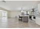 Modern kitchen with stainless steel appliances, granite countertops, and a center island with seating at 94 Nicholas Dr, Dunedin, FL 34698