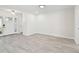 Open-concept living room with tile flooring, and a bright foyer at 94 Nicholas Dr, Dunedin, FL 34698