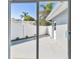A spacious patio with a privacy fence, perfect for outdoor entertaining and relaxation at 94 Nicholas Dr, Dunedin, FL 34698
