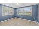 This is a bedroom boasting natural light with tile flooring and simple design at 9915 Aetna Ln, Port Richey, FL 34668