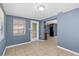 Dining room featuring tile flooring and an adjacent view of the kitchen area at 9915 Aetna Ln, Port Richey, FL 34668