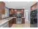 Updated kitchen features stainless steel appliances, granite countertops and tile flooring at 9915 Aetna Ln, Port Richey, FL 34668